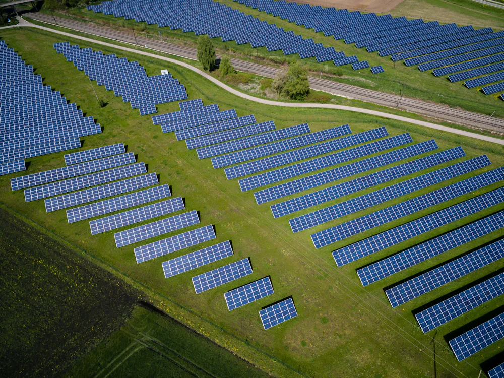 Rows of ground-mounted solar panels in a solar park